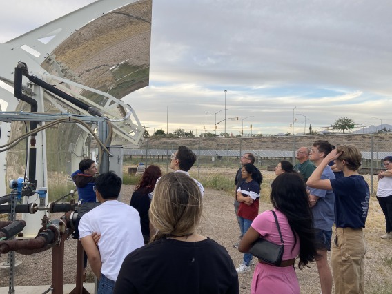 Students viewing concentrated solar-power collection system